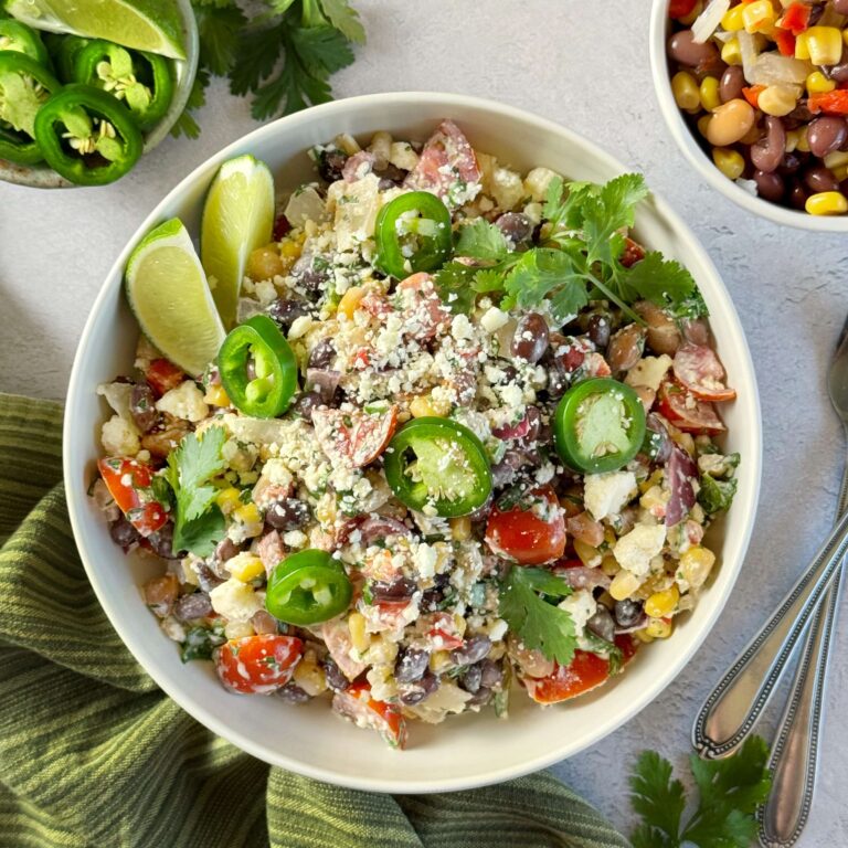 Mexican Street Corn Inspired Salad with Cowboy Caviar in a white dinner bowl
