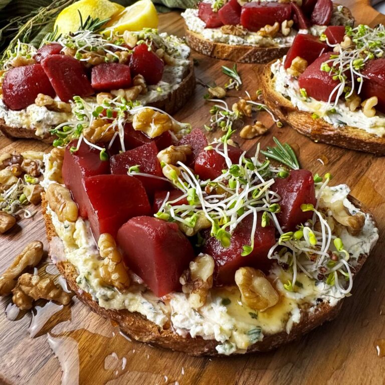 Wooden board with Herbed Cream Cheese and Sweet Beets on Toast