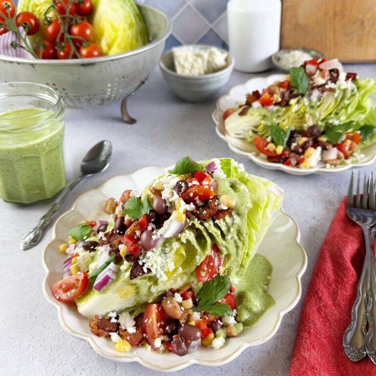 Southwest Wedge Salad with Cowboy Caviar on a white salad plate