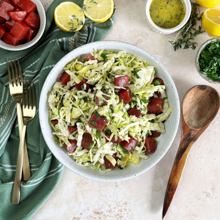 A dinner bowl with Lemony Cabbage Salad with Sweet Beets.
