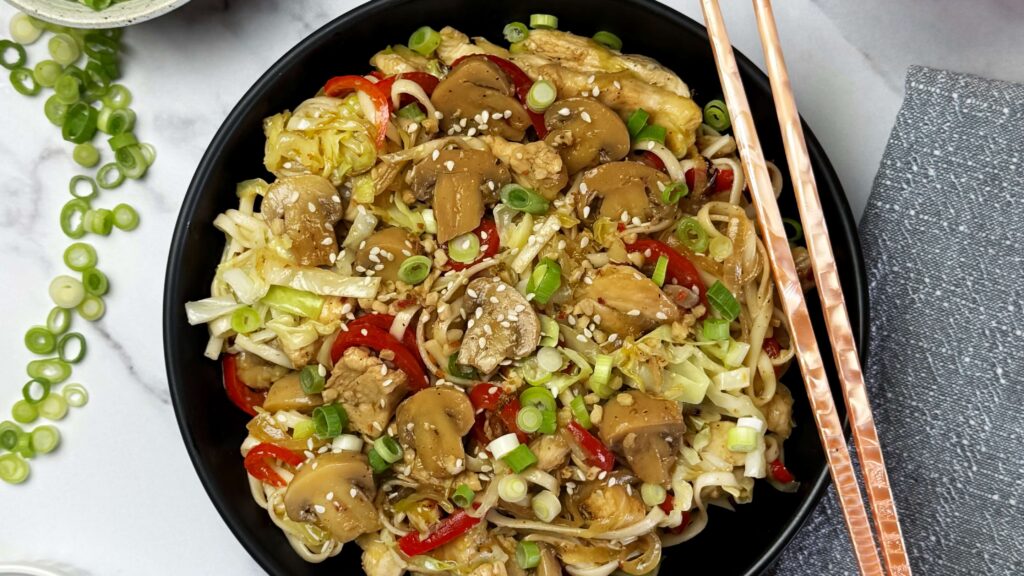 Stir-fried Noodles with Chicken, Cabbage, and Marinated Mushrooms