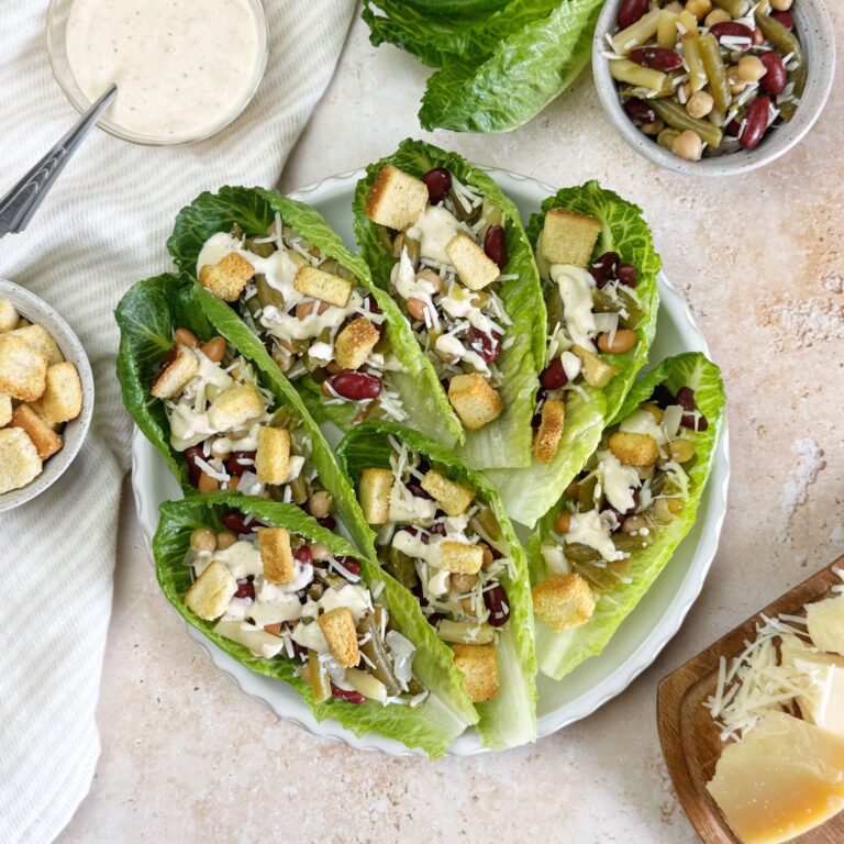 Five Bean Caesar Salad Cups on a white dinner plate.