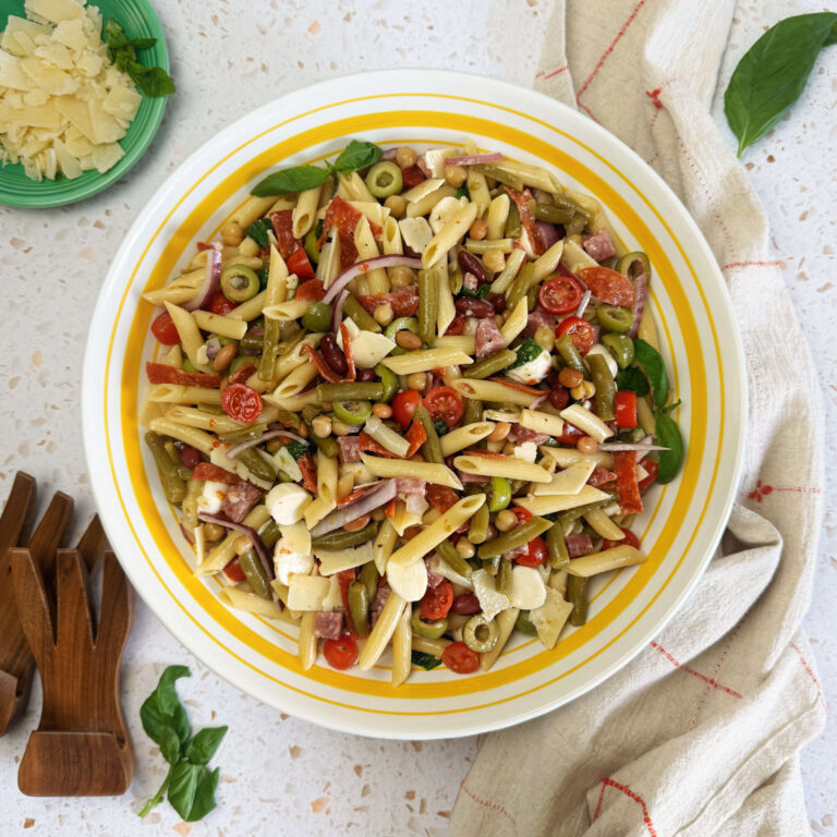 A lard dinner bowl filled with Antipasto/Italian Pasta Salad with Five Bean Salad