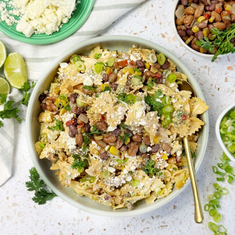 A bowl of Creamy Sweet Corn Inspired Pasta Salad with Charred Cowboy Caviar